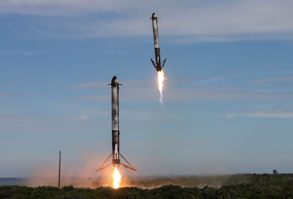 Two boosters return to the Cape Canaveral Space Force Station after launch from the nearby Kennedy Space Center after a SpaceX Falcon Heavy rocket carried the fourth and final satellite of the next-generation series of geostationary weather satellites for NASA and NOAA in Cape Canaveral, Florida, U.S. June 25, 2024. REUTERS